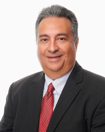 Adam Gonzalez of COSTEP in a black suit and red tie. 