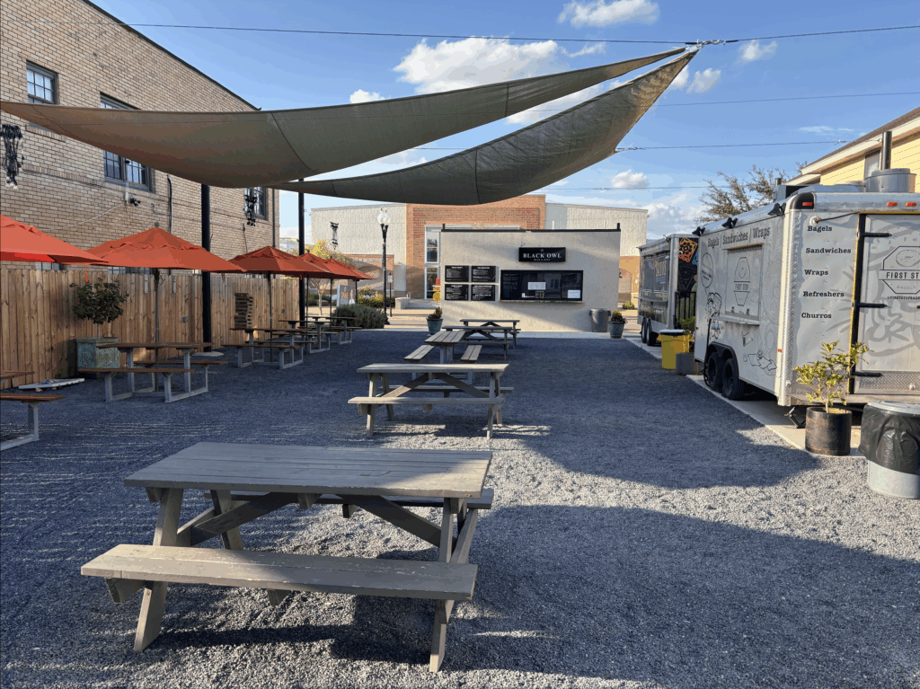 Outdoor seating with new awnings at McIntyre Square Eatery & Bar in Edinburg, supported by Edinburg EDC grant funding.
