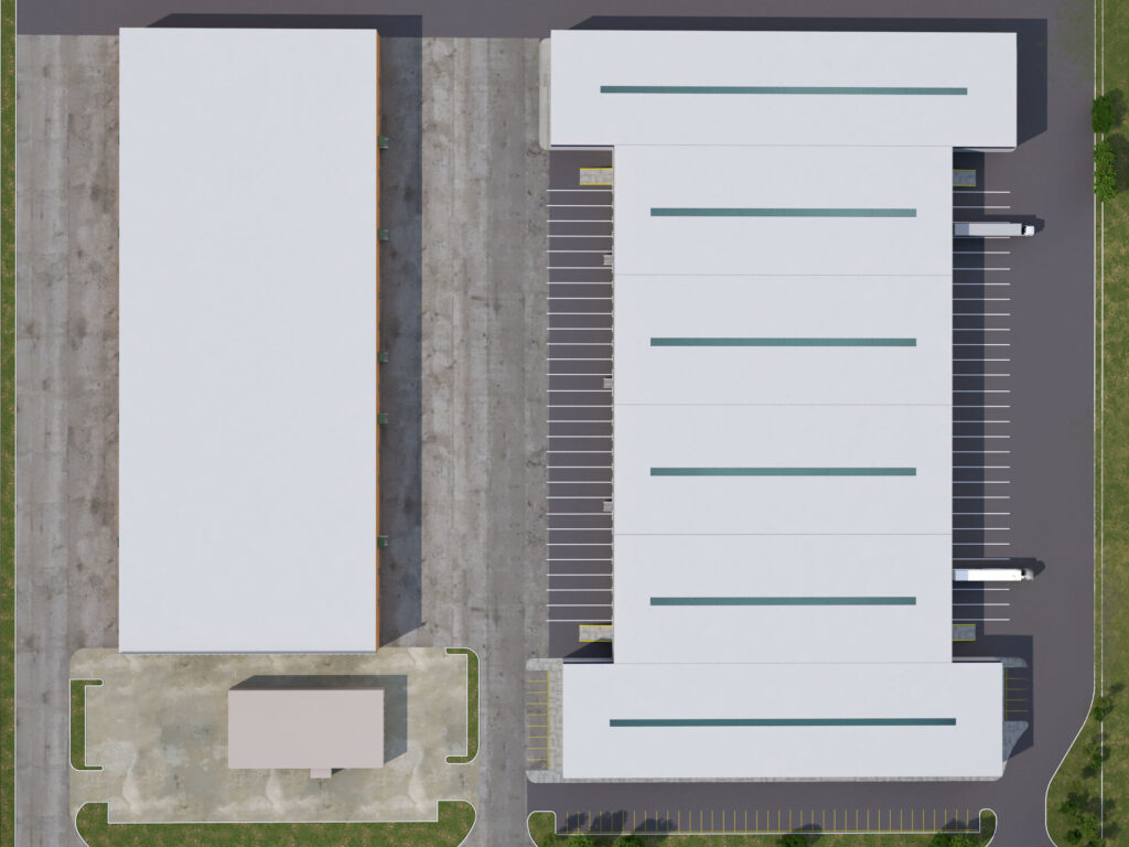An aerial view of two white buildings surrounded by pavement and green space.