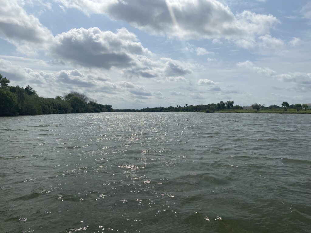 Wide view of the Rio Grande River under partly cloudy skies in Mission, Texas, along the U.S.-Mexico border. Photo taken May 31, 2021.