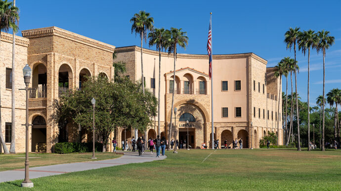 A UTRGV campus building is shown with palm trees and students walking inside with a blue sky.
