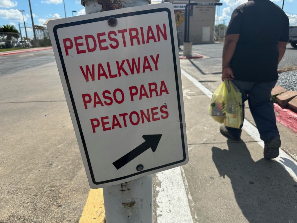 A man walks with a bag