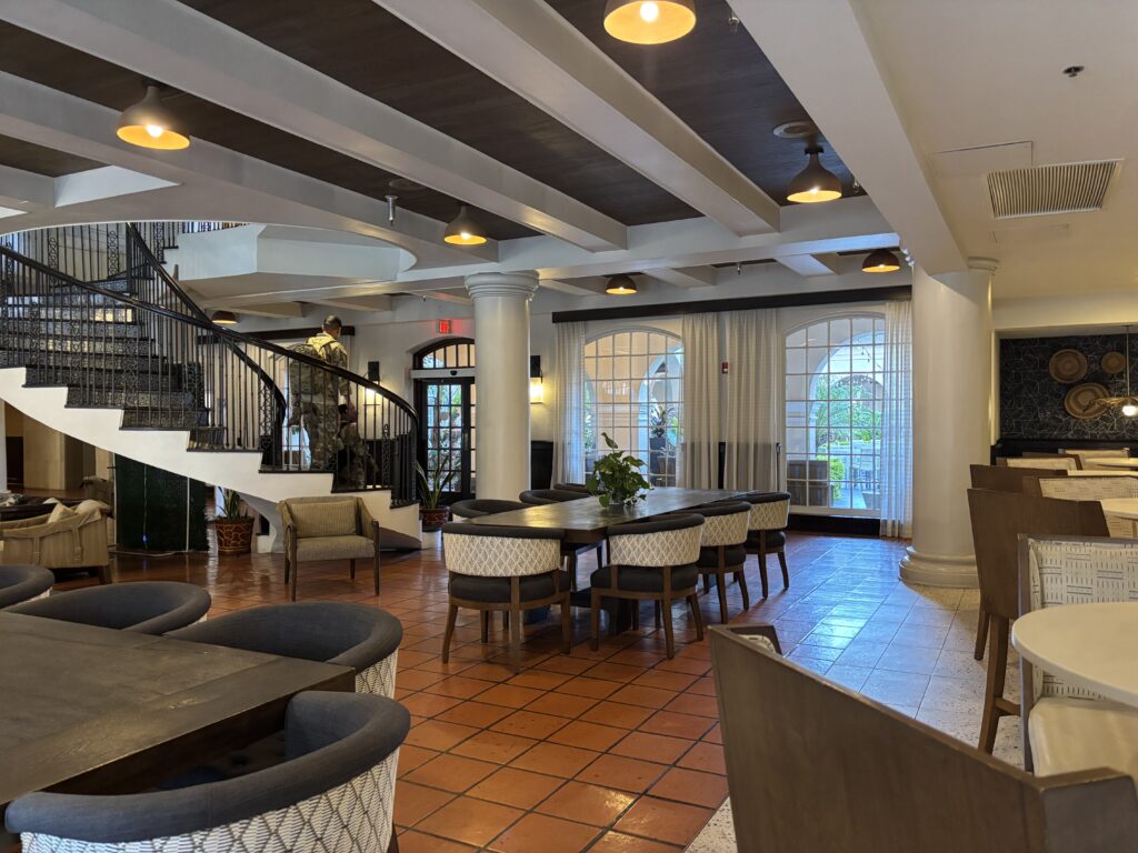 Two soldiers walk up a staircase inside Casa de Palmas hotel lobby in McAllen.