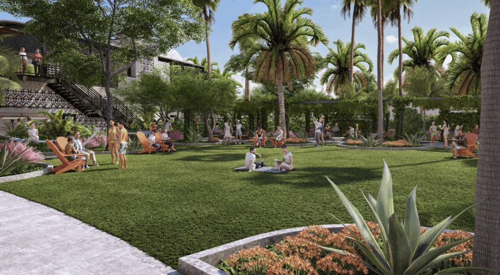 Tropical plants with a hotel and people on grass