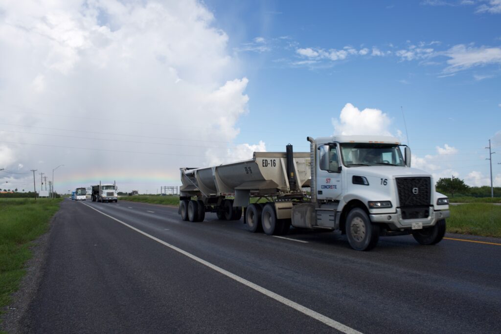 Trucks driving down the road in Brownsville