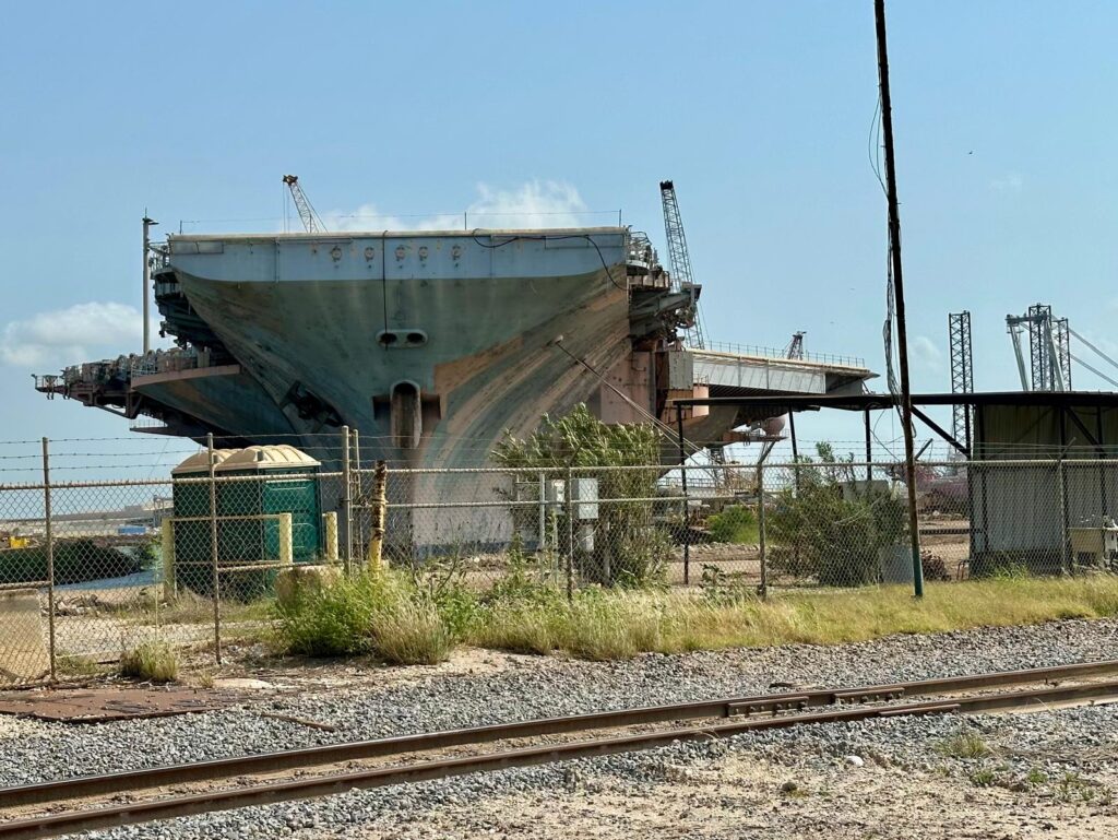 Large vessel structure at the Port of Brownsville industrial yard.