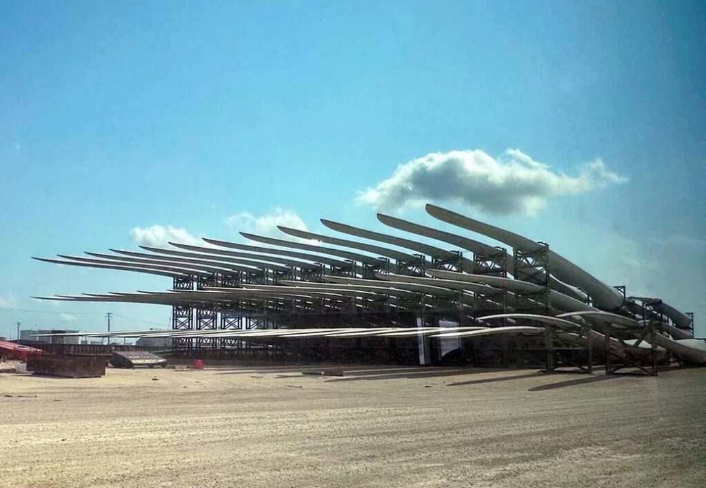 Wind turbine blades stacked in rows at the Port of Brownsville.