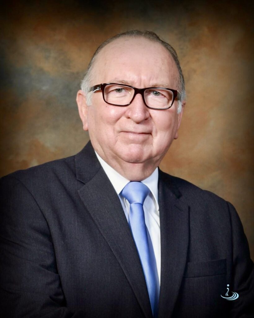 Portrait of Constantino Castillo wearing a suit and tie.
