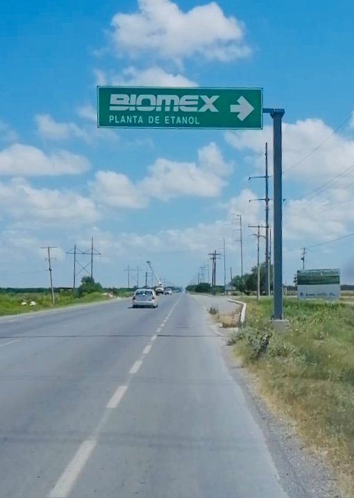 Highway sign directing drivers to the Biomex ethanol plant in Valle Hermoso.
