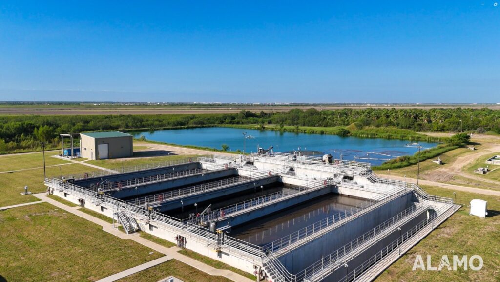 Aerial view of the Alamo wastewater treatment plant with surrounding ponds and open land.
