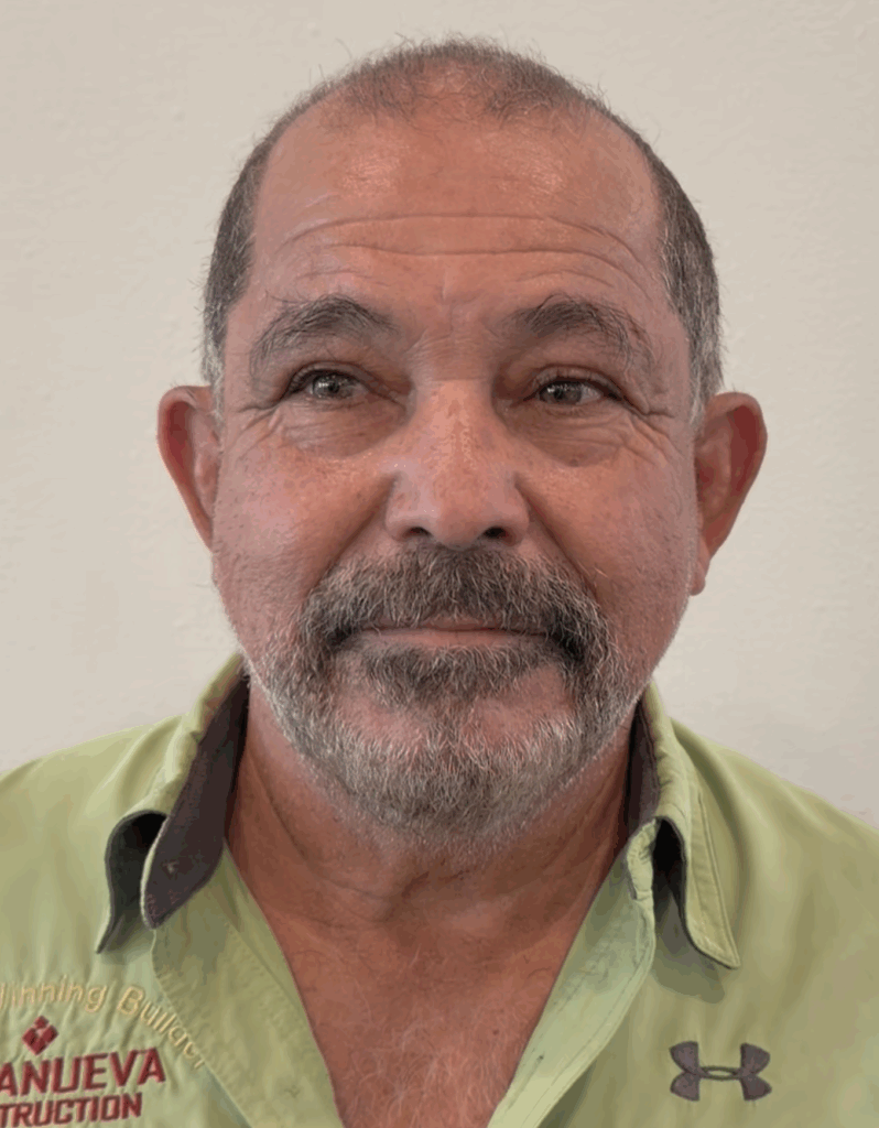 A man wearing a green shirt