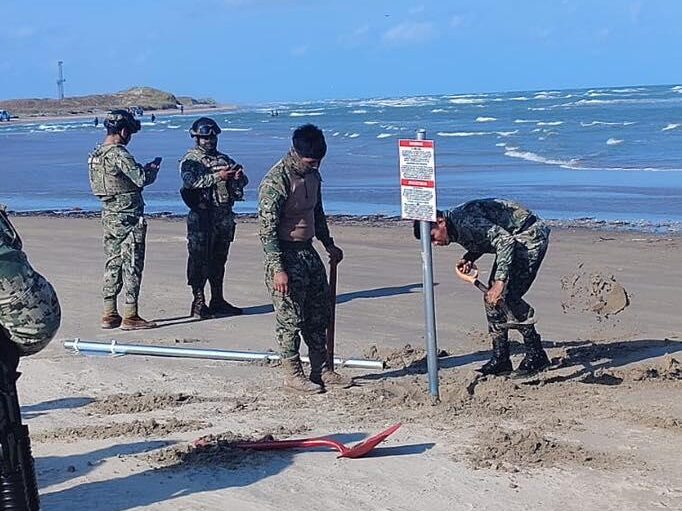 Mexico removes unauthorized U.S.-marked signs from Playa Bagdad near Matamoros as binational probe intensifies