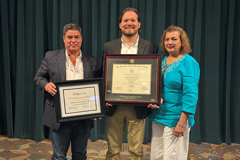 Adrian Barrera poses with his diplomas alongside his parents, Lisa and Jerry Barrera.