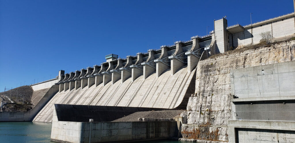 Concrete spillway and gates at Amistad Dam on the Rio Grande, a binational reservoir managed by the International Boundary and Water Commission.
