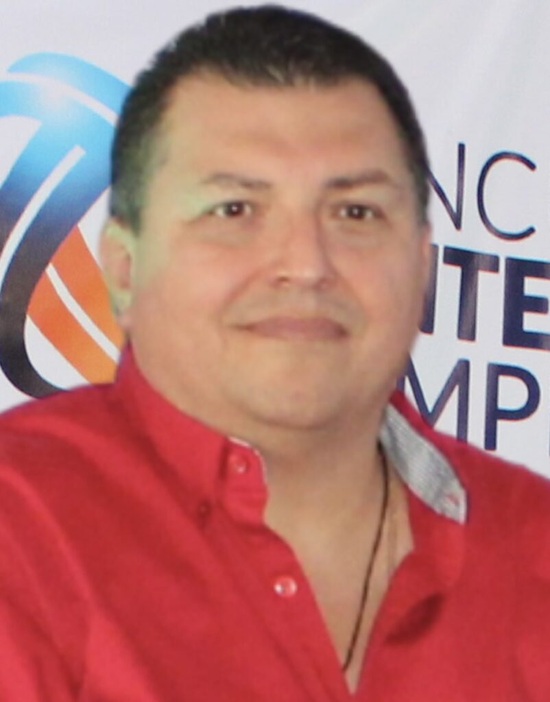 Headshot of Carlos González.