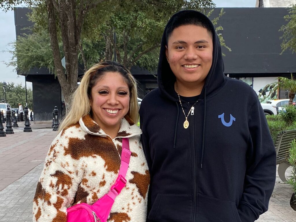 Couple poses in Reynosa’s holiday market during their visit from Houston.