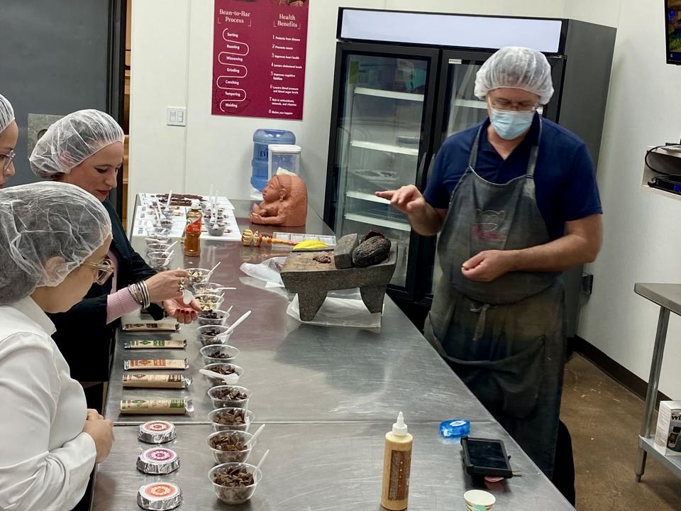 Visitors participate in a guided tour at Mozna Chocolate in Hidalgo.