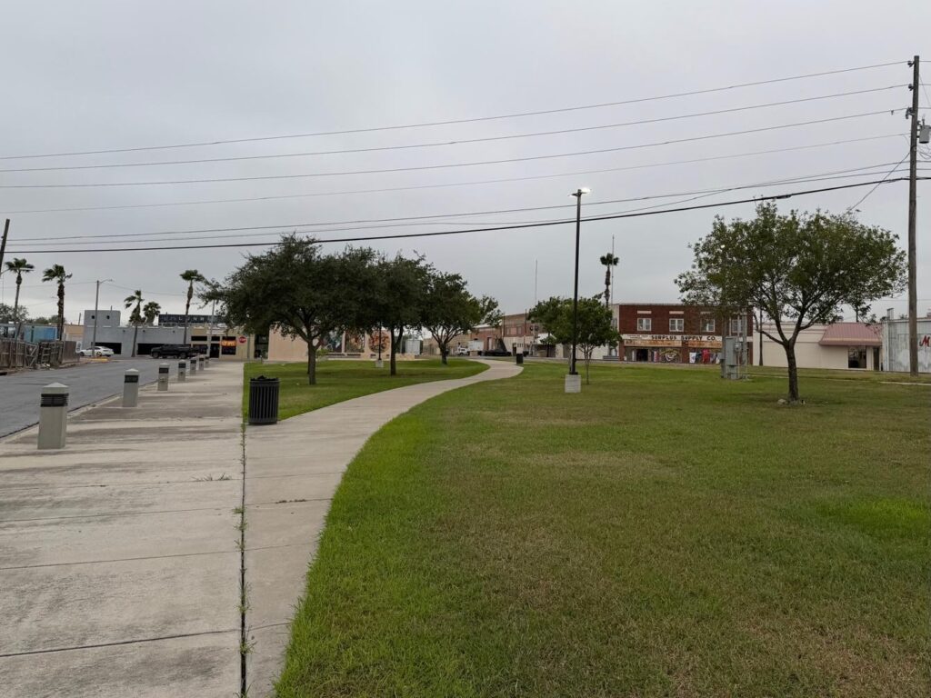 Open green space and walkway at Centennial Park in downtown Harlingen.