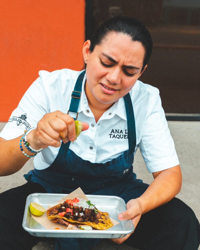 Ana Liz Pulido, owner of Ana Liz Taqueria in Mission, prepares a taco.