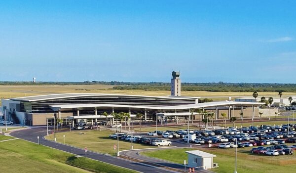 Aerial view of Brownsville South Padre Island International Airport terminal and parking areas.