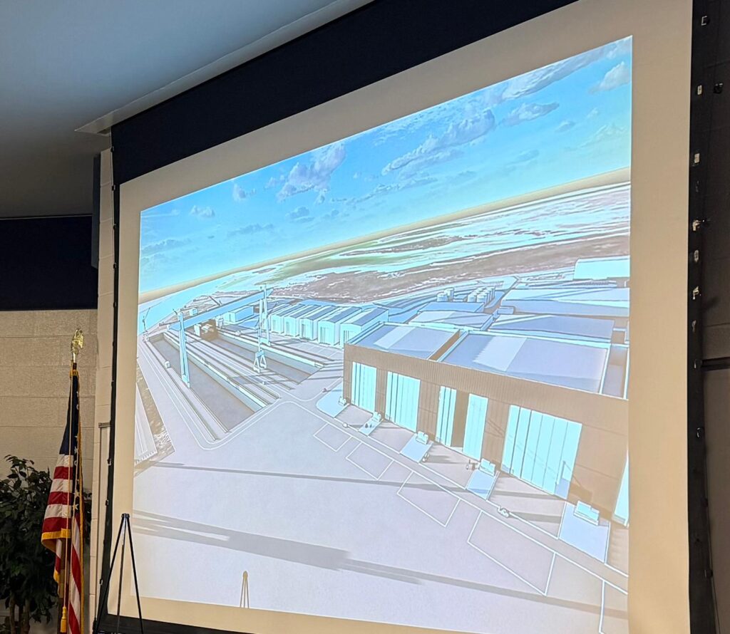 Rendering of the proposed Saronic Technologies shipyard with large industrial buildings and cranes along the Brownsville Ship Channel.
