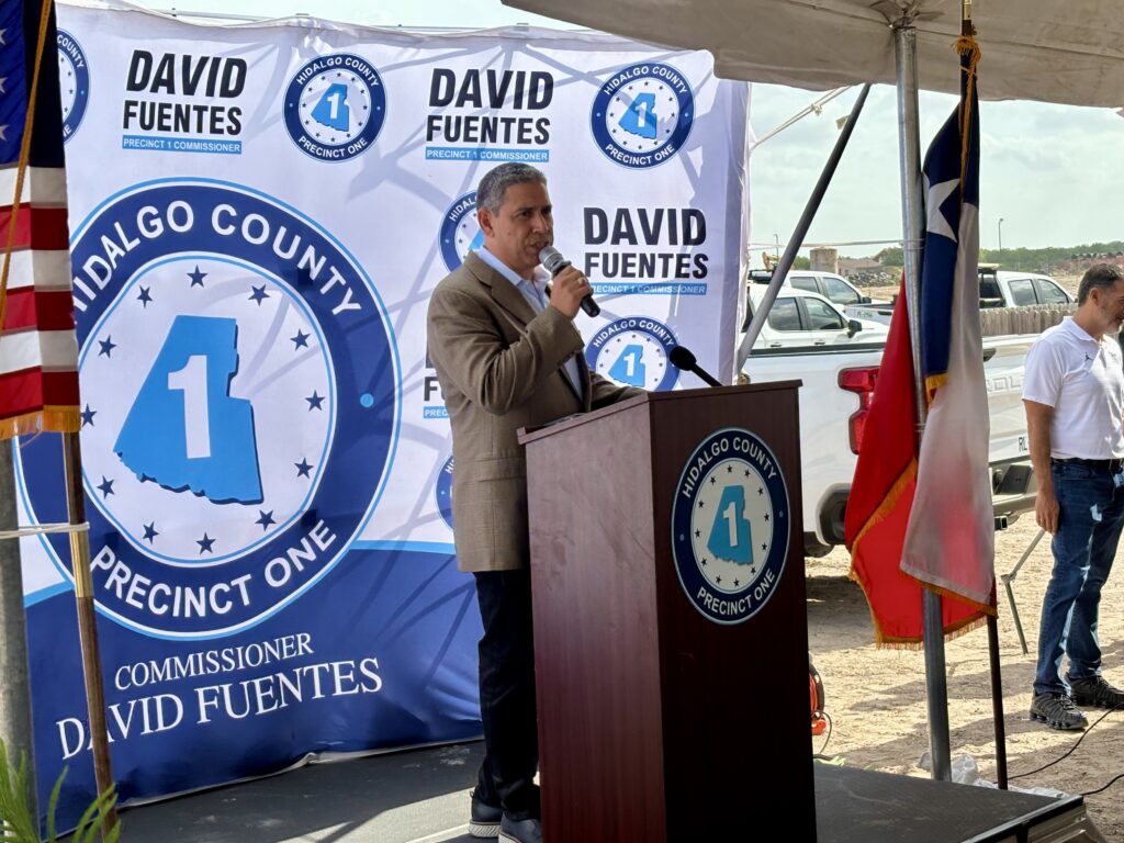 David Fuentes speaks at the podium during a public event for a Hidalgo County drainage project.