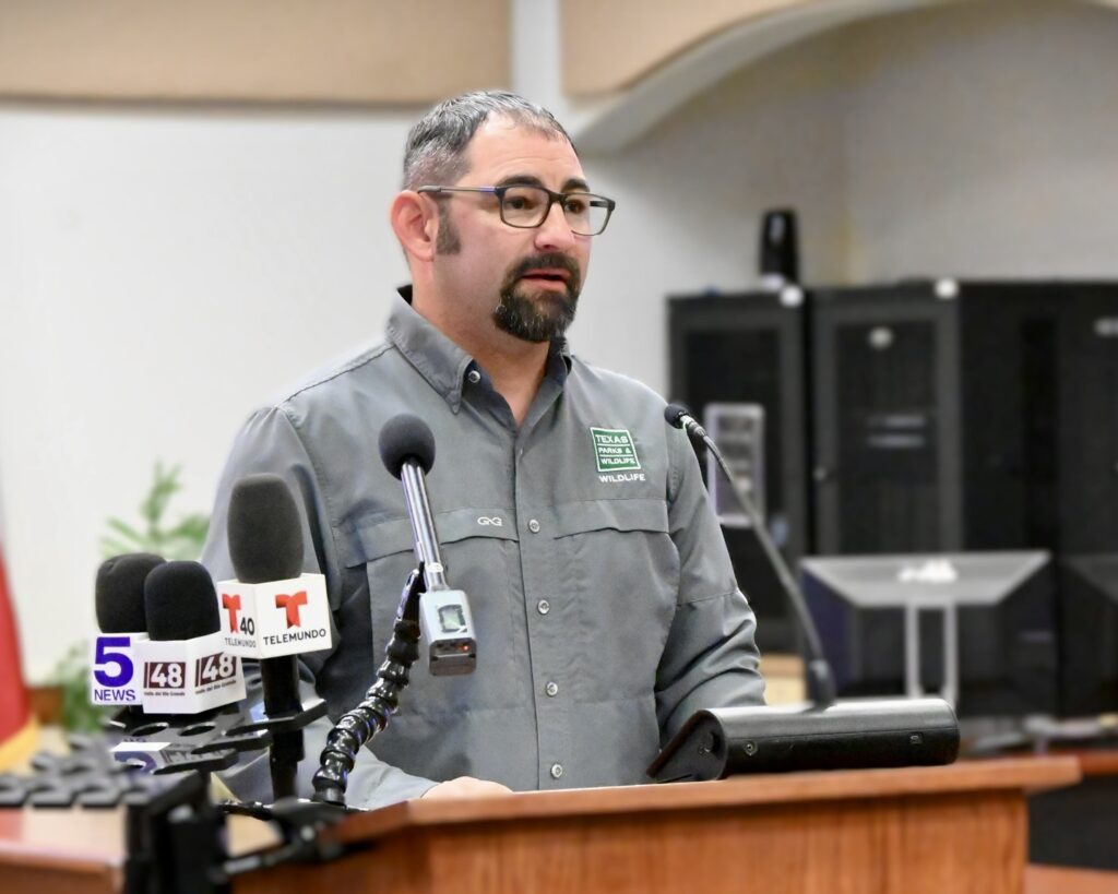 Freddy Nieto speaks at a podium during a regional New World screwworm press conference in Weslaco.
