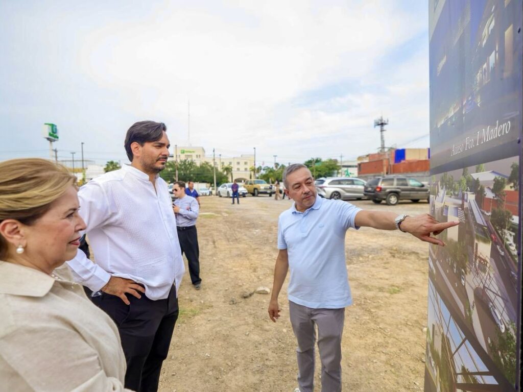 Reynosa Mayor Carlos Peña Ortiz and developers stand beside a project rendering during a groundbreaking event for Distrito Zafiro.