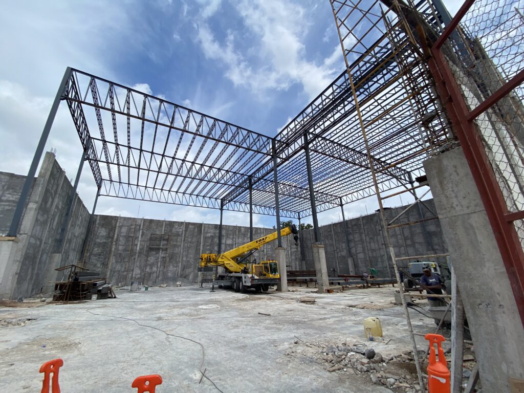 Construction crews work inside a new sports and recreation complex under development in Reynosa.