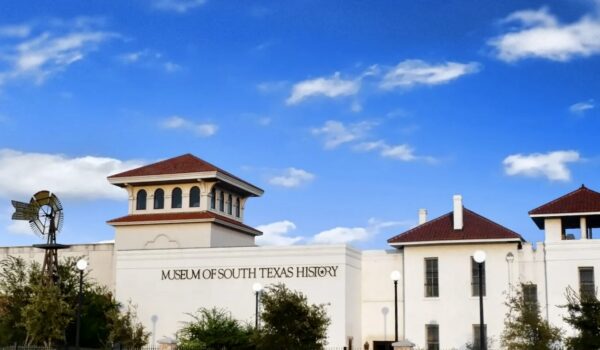Exterior of the Museum of South Texas History in Edinburg, featuring the museum’s white façade, red-tiled roof towers and landscaped grounds. The museum is planning an $800,000 renovation to expand gallery and public spaces.