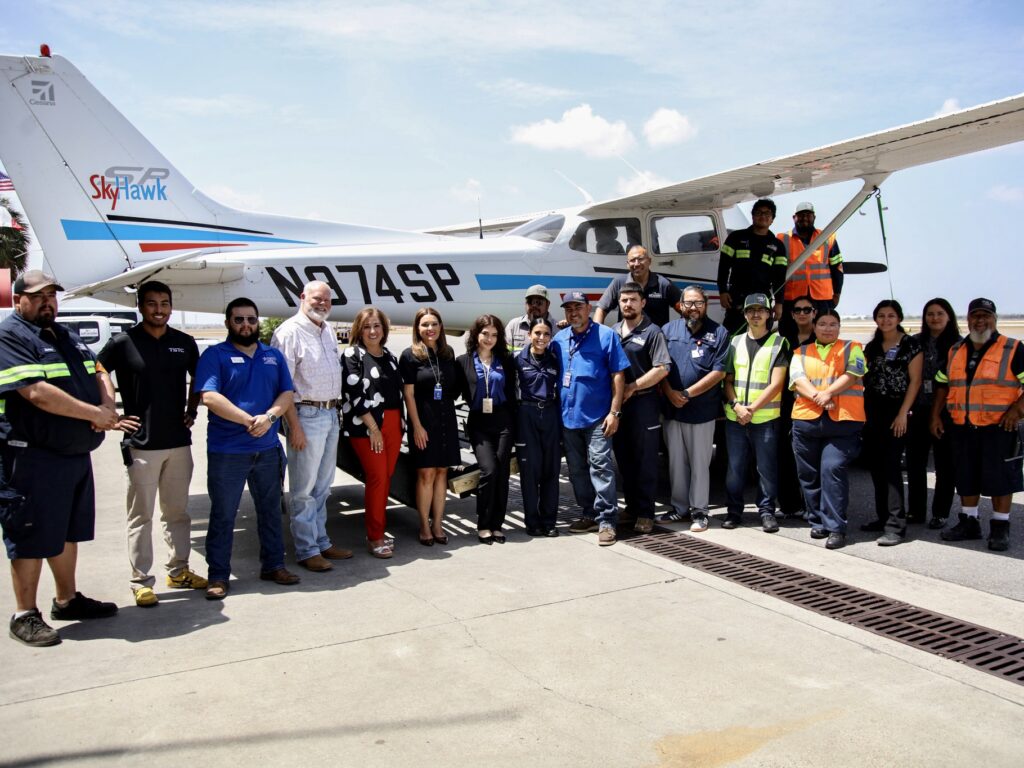 TSTC students, staff and partners gather around a Cessna 172 aircraft in Harlingen.