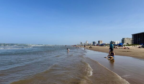 Beach and development within South Padre Island city limits, south of the north-end area where a new hotel or multifamily project is being considered.