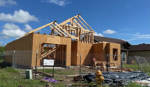 A single-family home under construction in a new Brownsville subdivision.