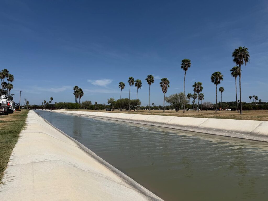 Water flowing through a concrete irrigation canal alongside Ebony Hills Golf Course in Edinburg.