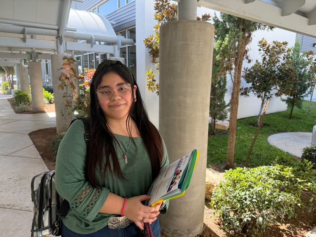 McAllen native Valeria Perez, 18, holds job-search materials after attending a Workforce Solutions job fair in Pharr.