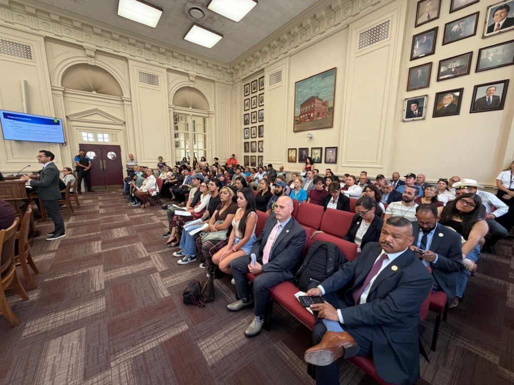 Residents sit in the audience during a Brownsville City Commission meeting discussing proposed zoning changes for data centers and other businesses.