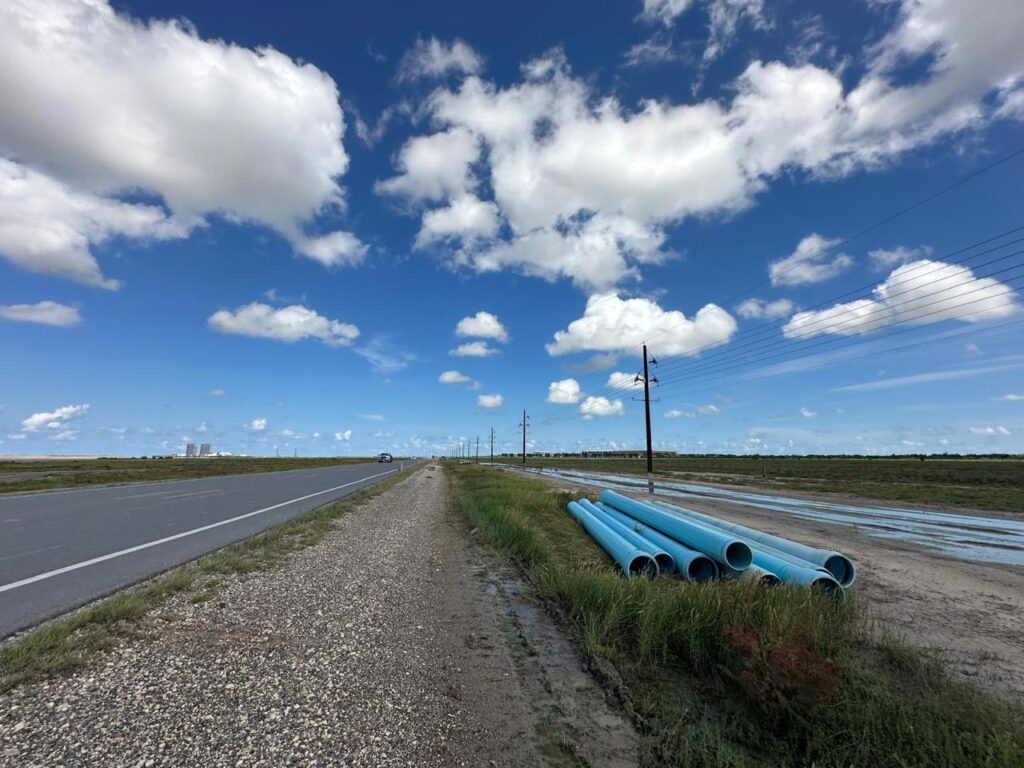 Water pipes sit along State Highway 4 leading to Starbase as SpaceX and Brownsville move forward with a $220 million agreement to fund regional water projects.