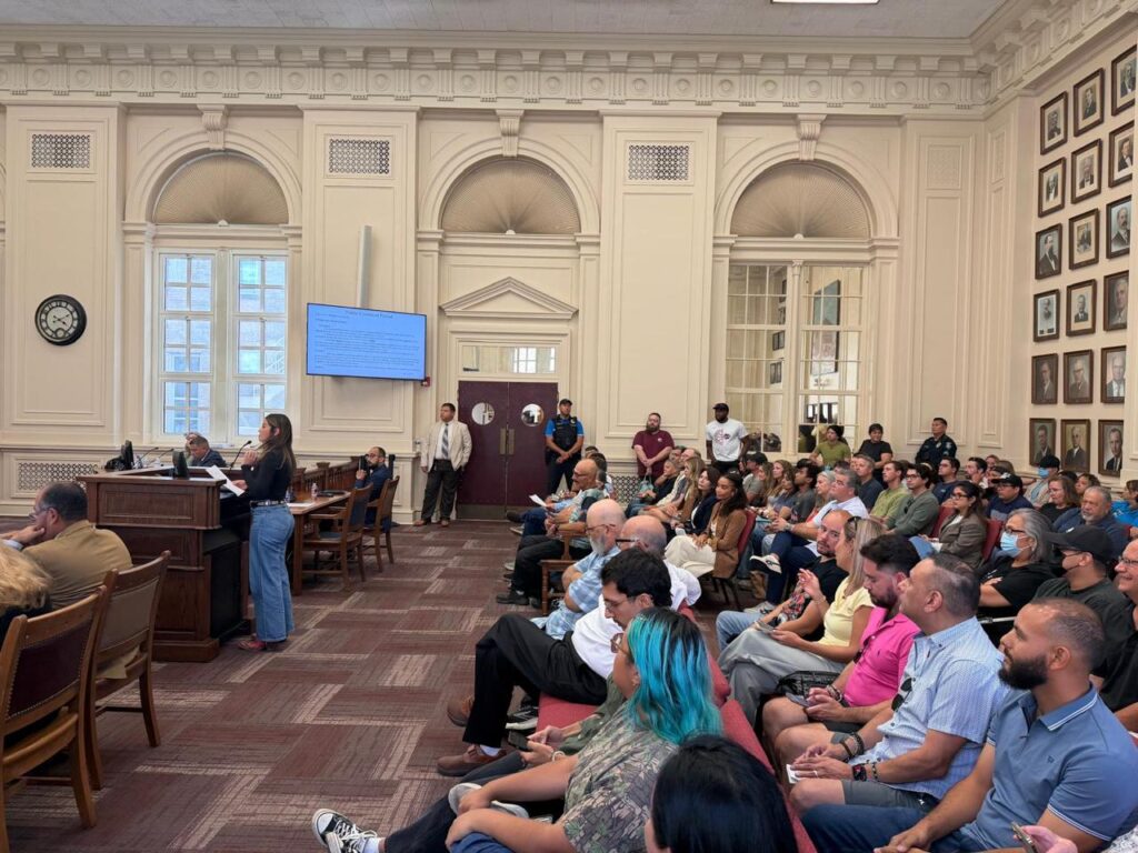 SpaceX legal and compliance analyst Blanca Campbell speaks during a packed Brownsville City Commission meeting.