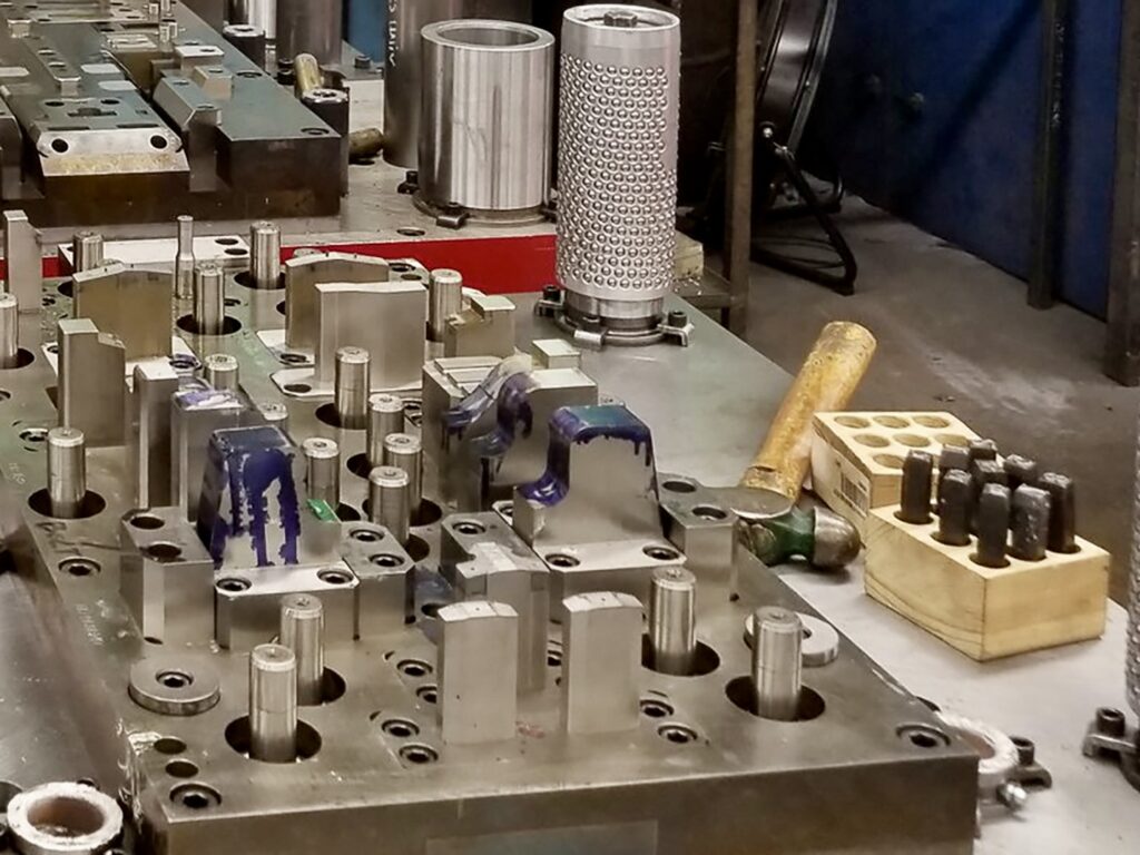 Metal stamping tooling and dies at a Universal Metal Products facility.