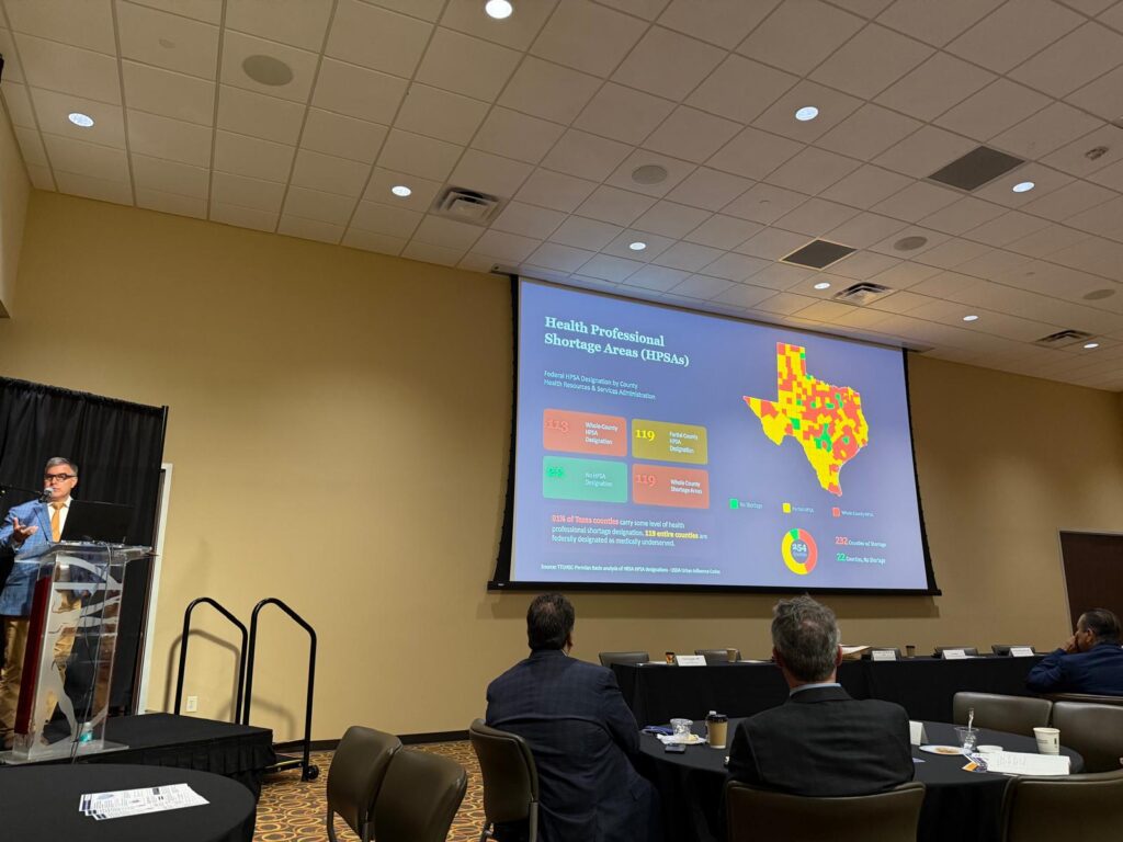 Dr. Adrian Billings presents a map of health professional shortage areas across Texas.